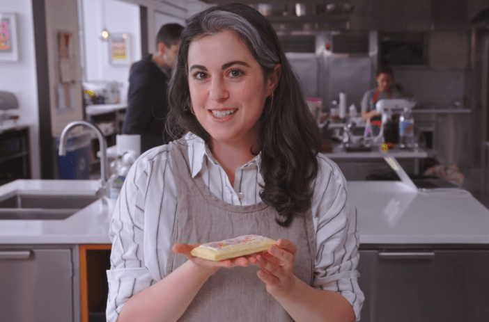 Former Bon Appétit Test Kitchen pastry chef Claire Saffitz holding a homemade poptart