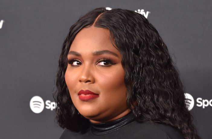 Lizzo wearing a black dress at the Spotify Best New Artist 2020 party