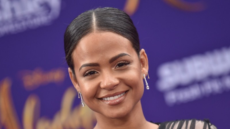 Christina Milian wears a black dress to the premiere of Aladdin