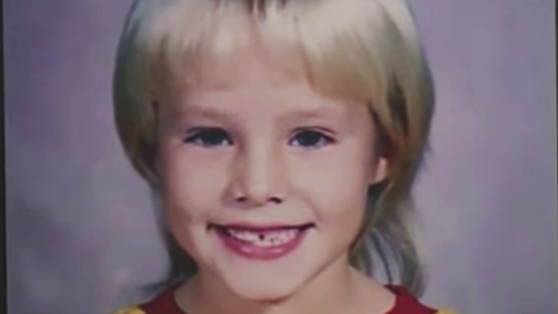 A childhood photo of Kristen Bell with her hair styled in a mullet