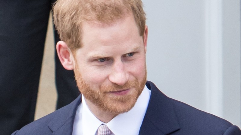 Prince Harry wears a dark blue suit as he attends a royal event