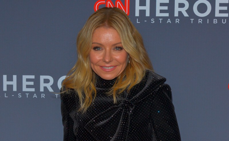 Kelly Ripa smiling in a black outfit
