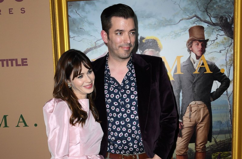 Zooey Deschanel and Jonathan Scott standing with each other at a movie premiere