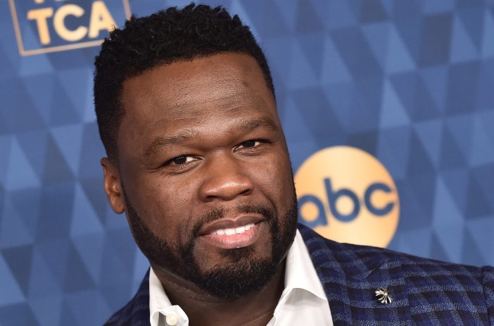Close up of 50 Cent wearing a plaid suit in January 2020