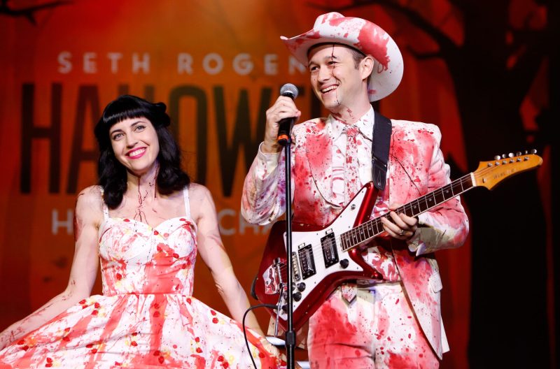 Joseph Gordon Levitt and his wife, Tasha McCauley, on stage at a Halloween event