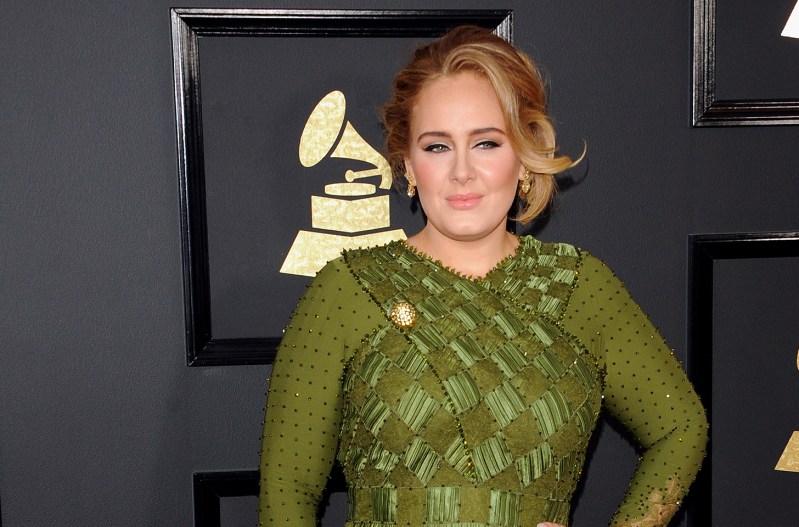 Adele at the Grammys in a green dress.