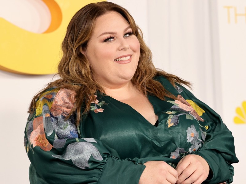 Chrissy Metz smiles in emerald dress with floral print