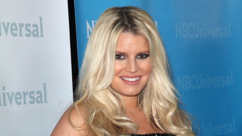 Jessica Simpson wears a black, sparkly dress on the red carpet
