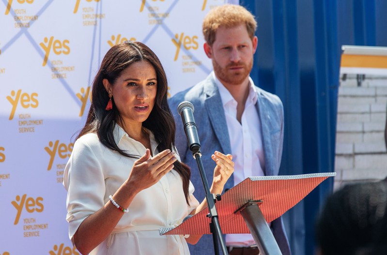 Meghan Markle and Prince Harry at a podium