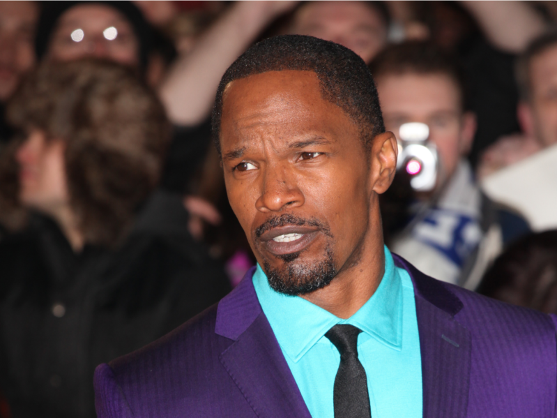 Jamie Foxx wearing a purple and bright blue suit