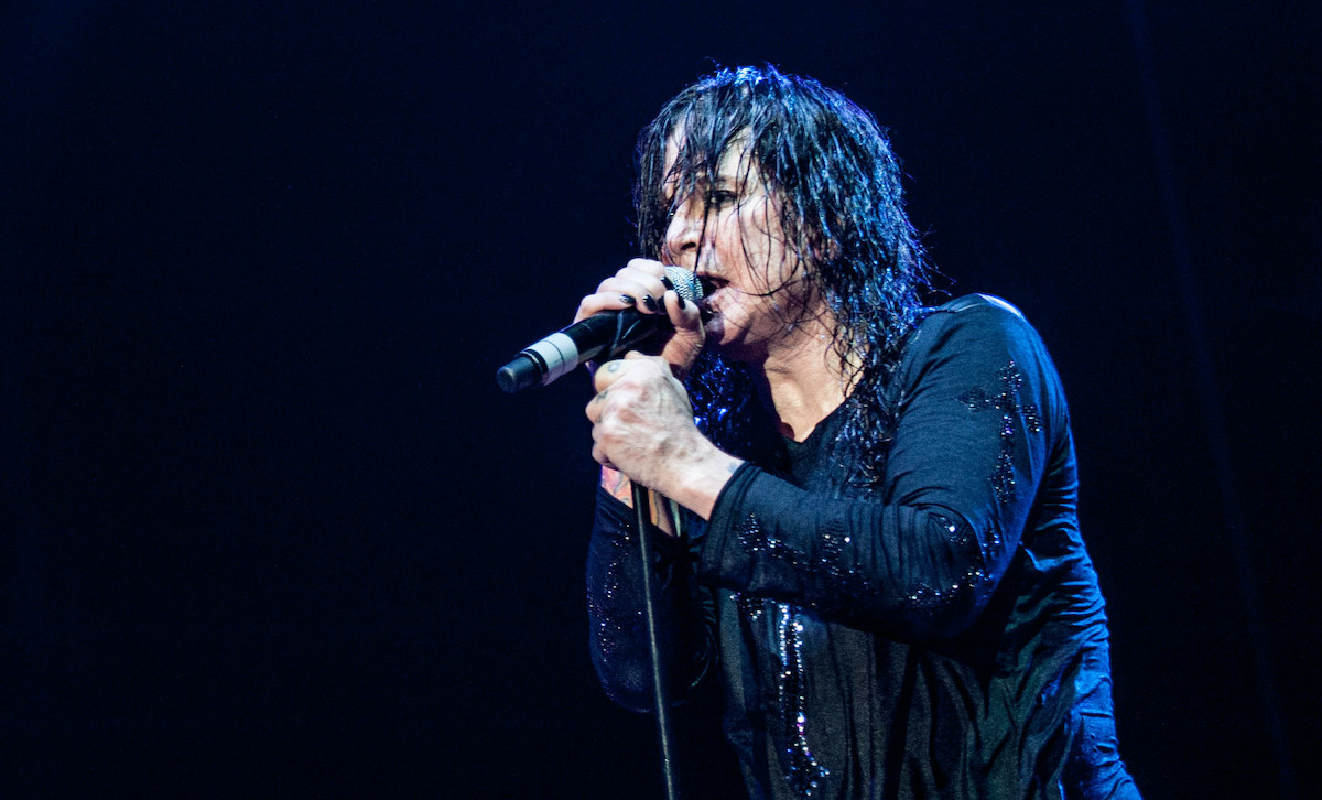 Ozzy Osbourne singing on stage