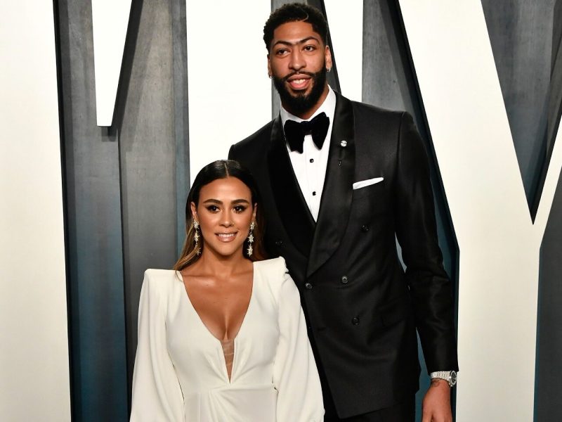 Anthony Davis wearing a black tuxedo with Marlen P, who is wearing a white dress.
