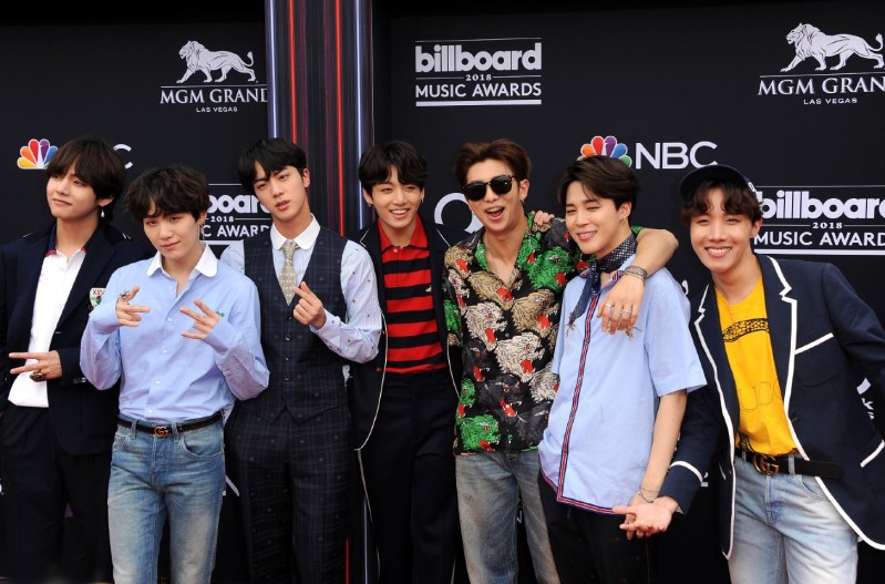 BTS Members posing together at the Billboard Music Awards.