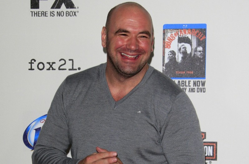 Dana White smiling and wearing a grey sweater.