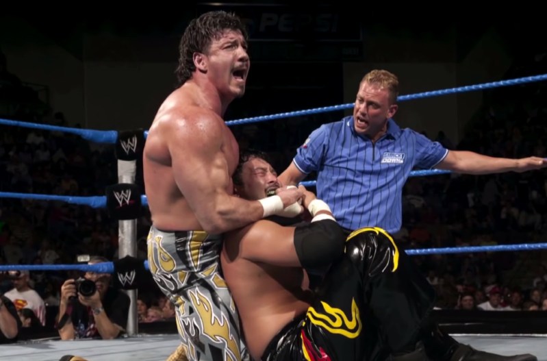 Eddie Guerrero competing in a wrestling match.