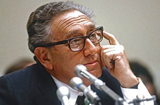 Henry Kissinger wearing a suit on Capitol Hill in 1984.