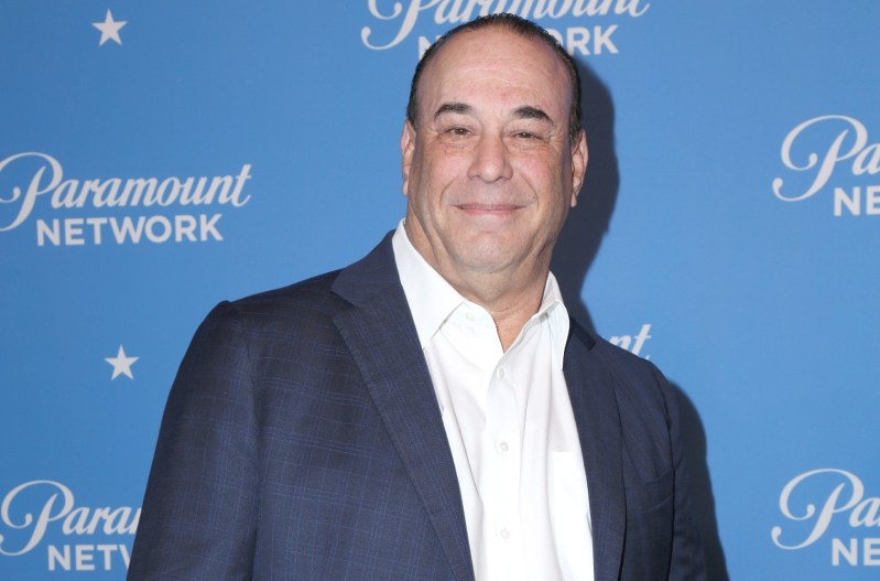 Jon Taffer wearing a blue suit and a white shirt.