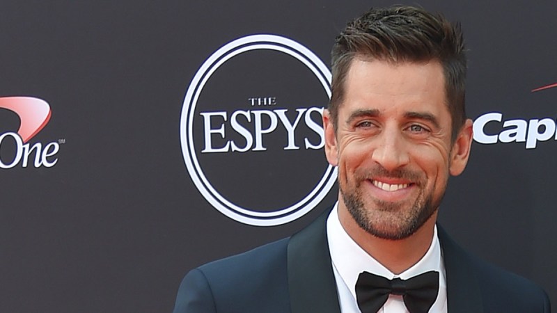 Aaron Rodgers stands on the ESPYS red carpet