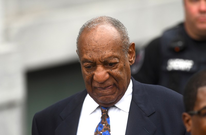 Bill Cosby in a suit, leaving court in 2018