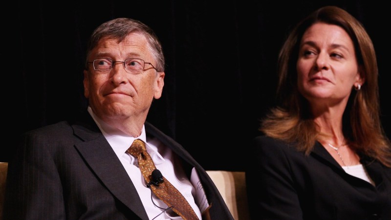 Bill and Melinda Gates sit together on stage