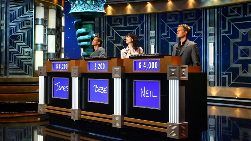 An onset photo featuring three celebrity contestants, including Neil Patrick Harris