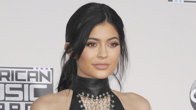 Kylie Jenner wears a black dress with cut outs on the red carpet