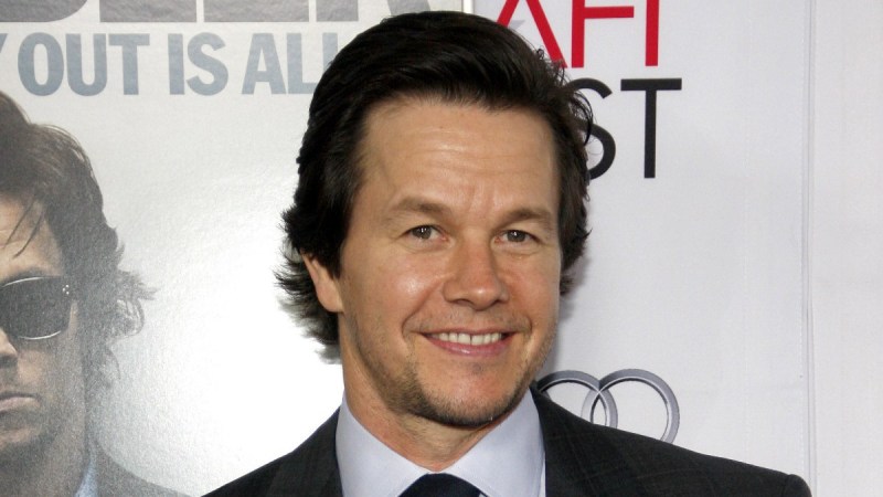 Mark Wahlberg wears a dark suit to a film premiere