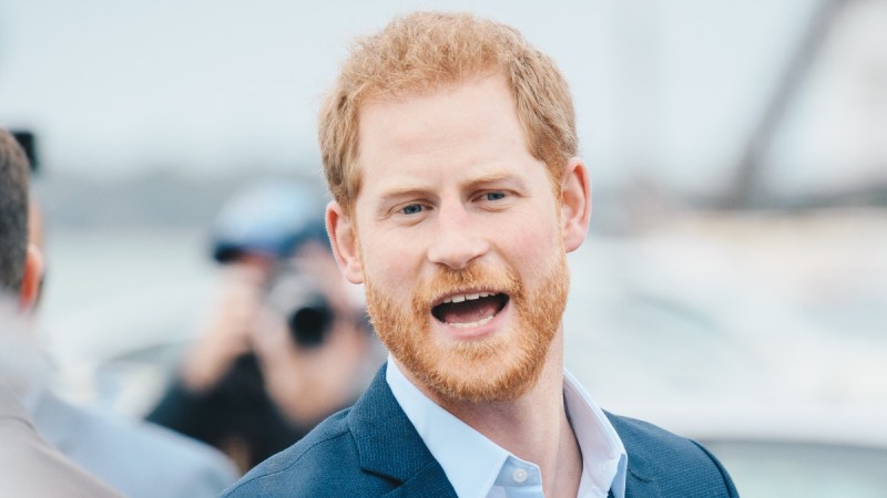 Prince Harry calls out to someone in the crowd while visiting New Zealand