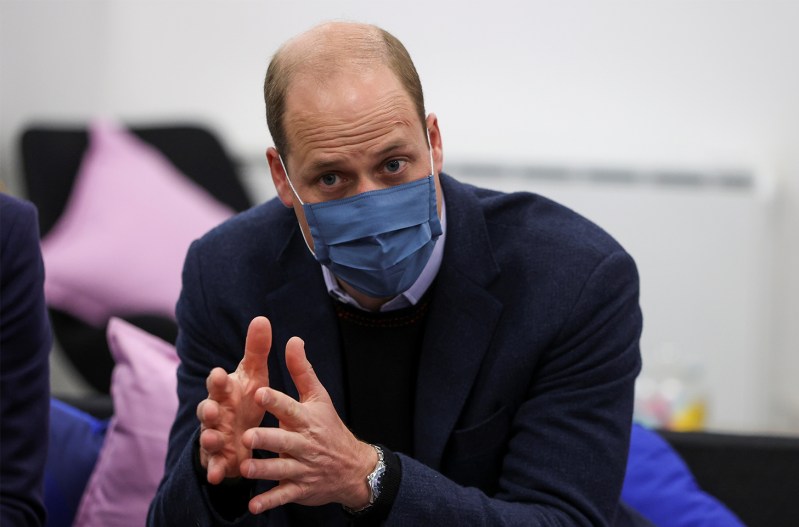 Prince William wearing a mask and a sweater