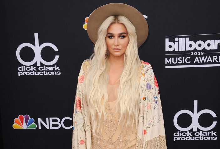 Cover image of Kesha at a red carpet event.