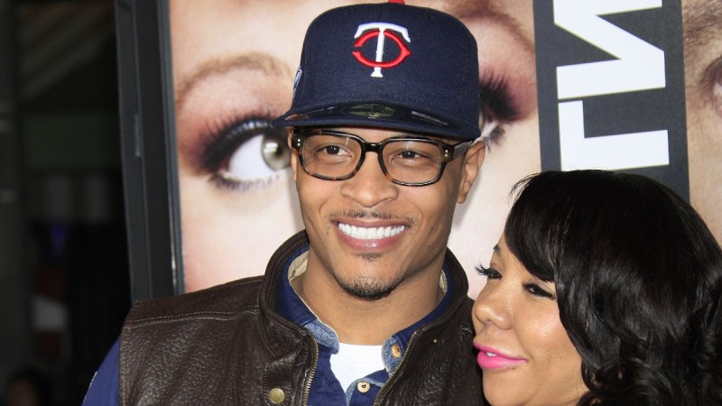 TI and his wife Tiny Harris pose for photos on the red carpet