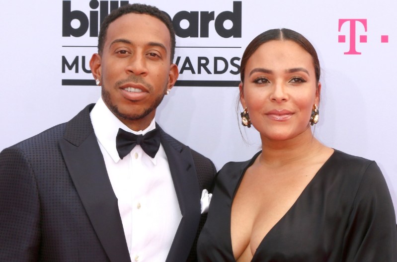 Ludacris and wife, Eudoxie Bridges at the Billboard Music Awards. He's wearing a tux, and she's wearing a black dress.