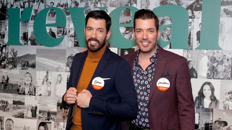 Jonathan and Drew Scott pose together at a media event