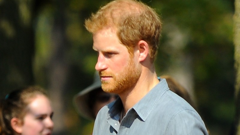 Prince Harry wears a blue shirt as he attends a royal event
