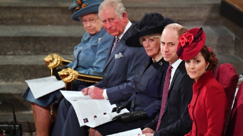 Queen Elizabeth, Prince Charles, Camilla Parker Bowles, Prince William, and Kate Middleton sit in a row in church