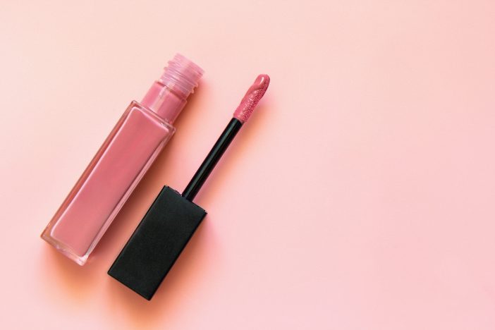 Image of pink liquid lipstick against a pink background.