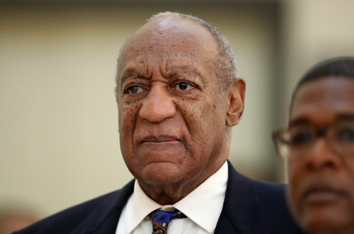 Bill Cosby returns to the courtroom after a break with his spokesman Andrew Wyatt at the Montgomery County Courthouse, during his sexual assault trial sentencing