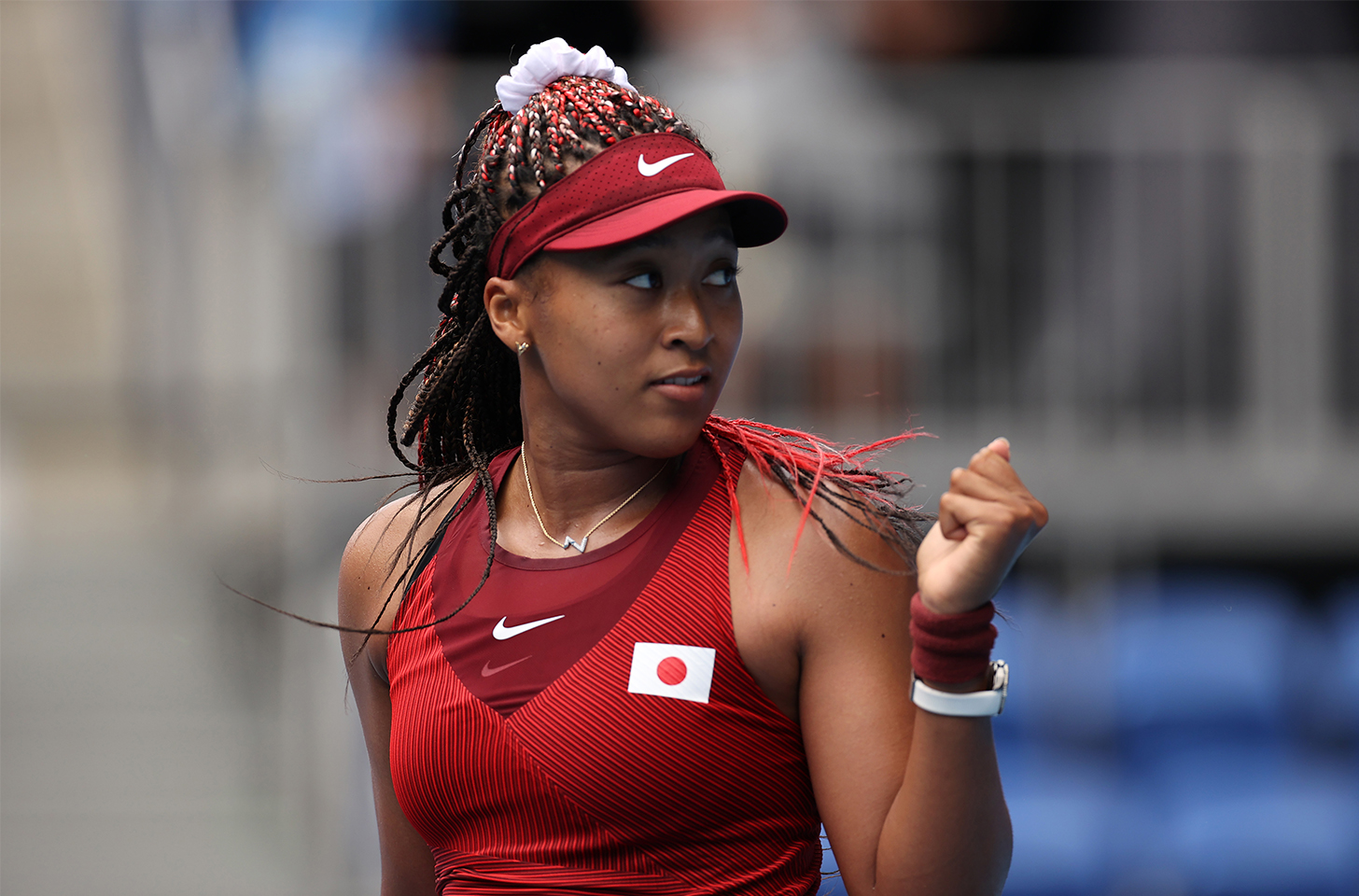 Naomi Osaka giving a fist pump at the Olympics