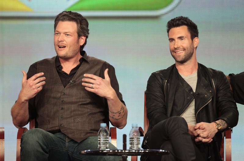 Blake Shelton with a "who me" look sitting next to Adam Levine