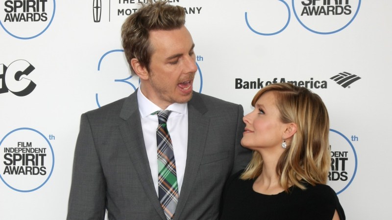 Dax Shepard speaks with wife Kristen Bell as the two pose for photos on the red carpet