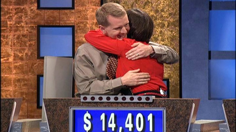 Ken Jennings hugs a fellow contestant on the set of Jeopardy!