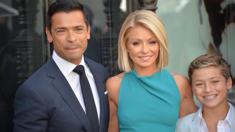Mark Consuelos, Kelly Ripa, and Joaquin Consuelos pose together at Kelly's Hollywood Walk Of Fame ceremony