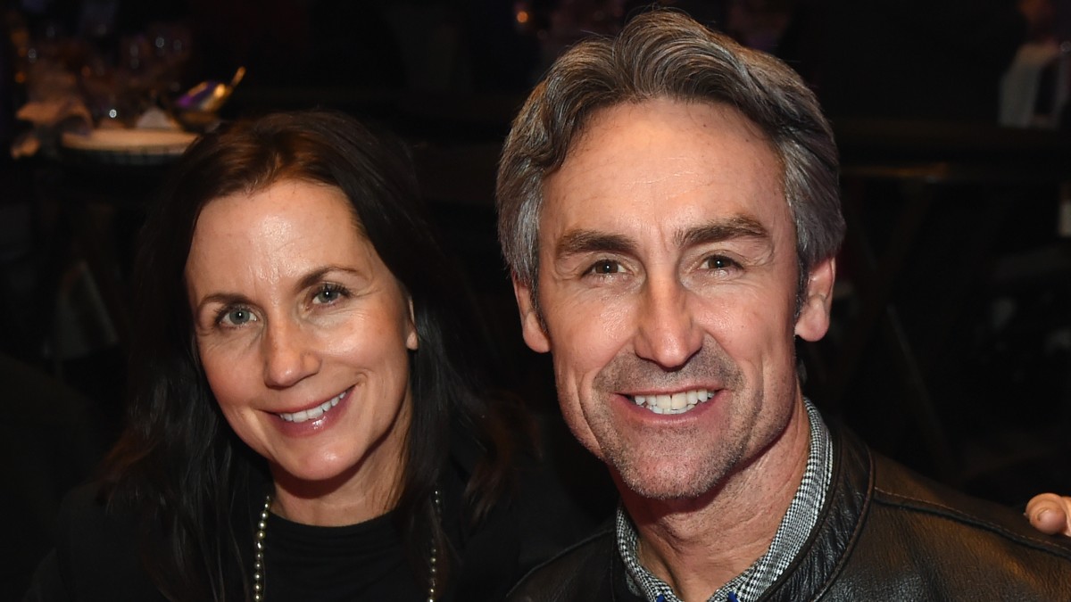 Jodi and Mike Wolf sit together at a charity event