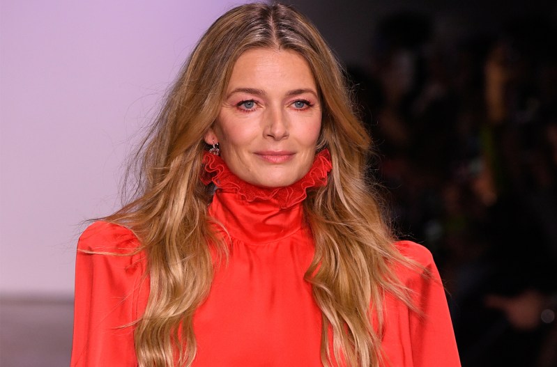Paulina Poriszkova in red, walking on a runway.