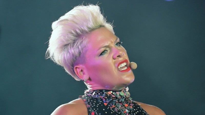 Pink sings while wearing a glittering costume onstage