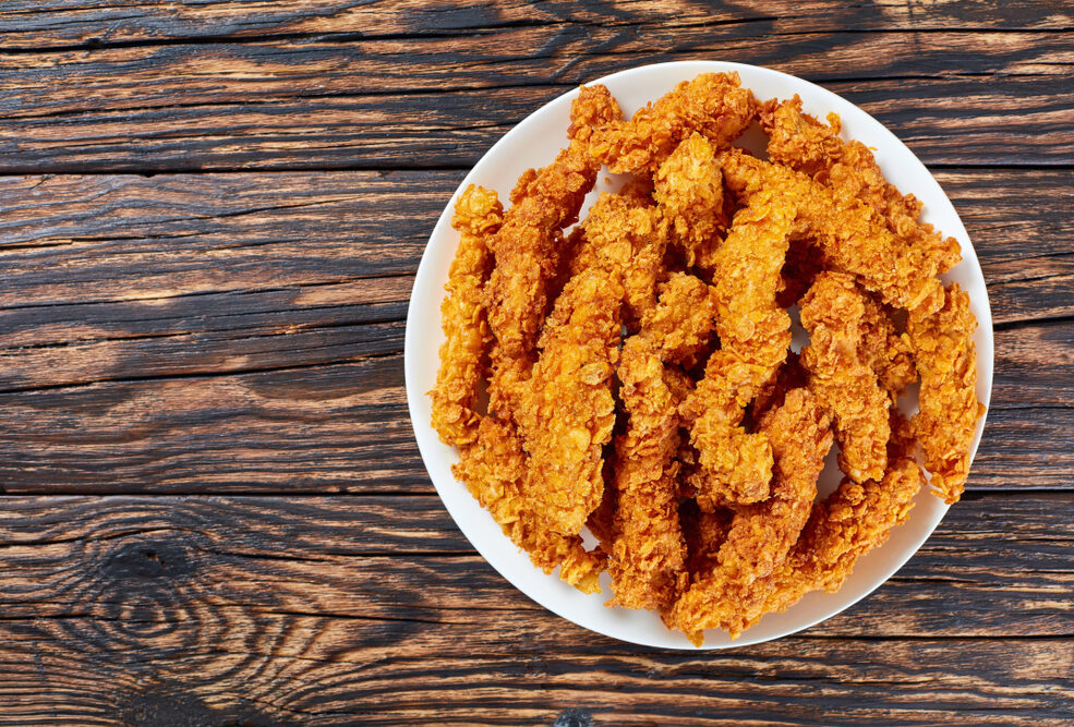 Plate of crispy chicken strips.