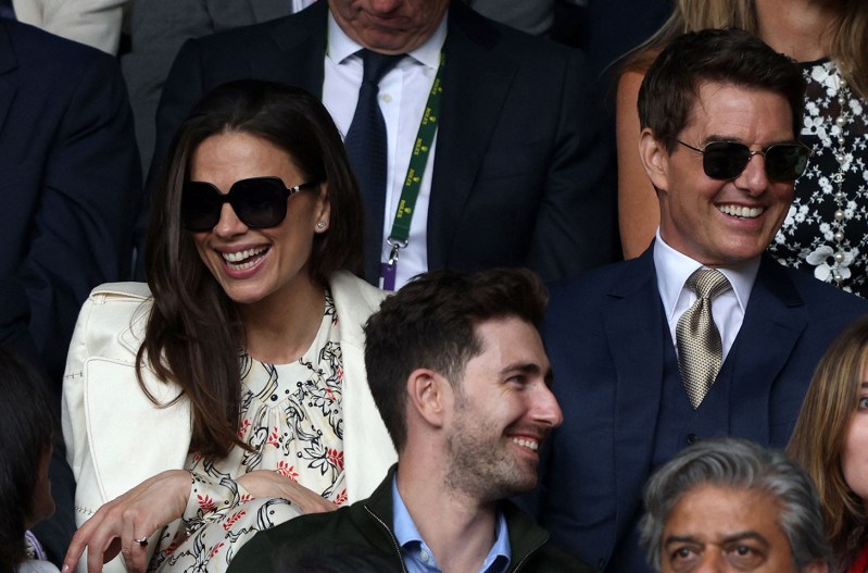 Tom Cruise in sunglasses on the right, Hayley Atwell in sunglasses on the left.