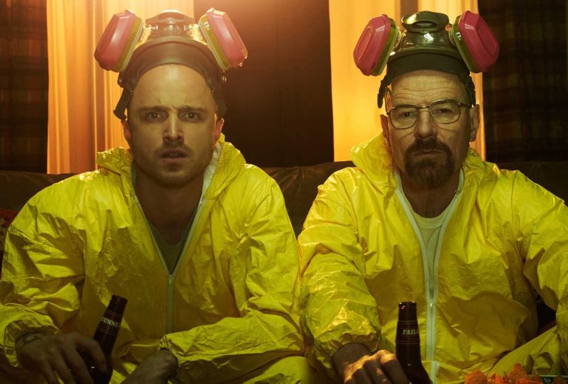 Jesse and Walter White in yellow hazmat suits on Breaking Bad.