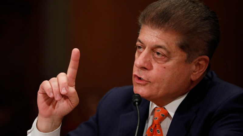 Andrew Napolitano gives testimony to Congress while wearing a dark suit