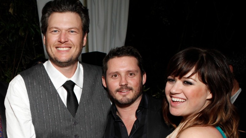Blake Shelton, Brandon Blackstock, and Kelly Clarkson pose together for a photo
